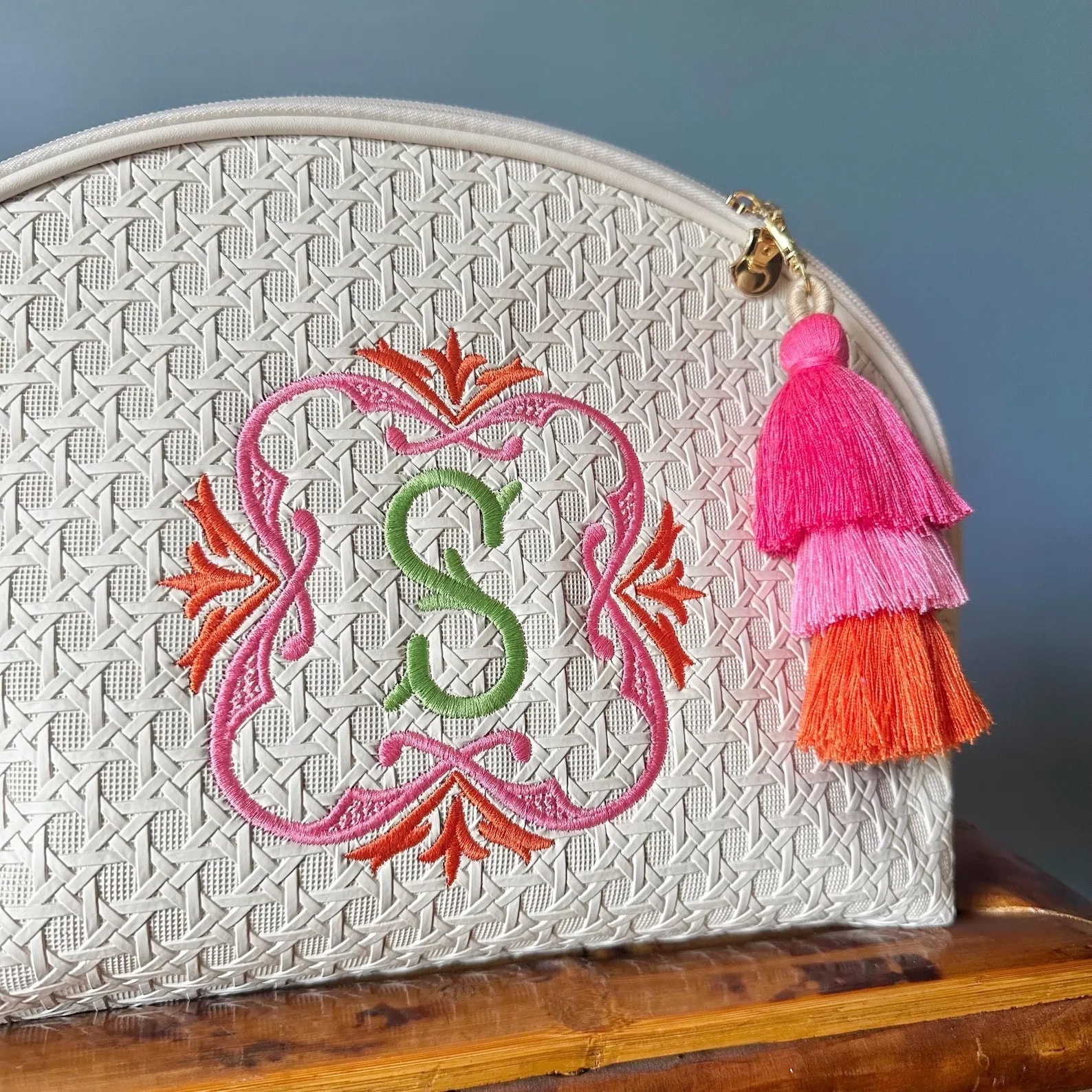 A monogrammed tile pouch with personalized initials
